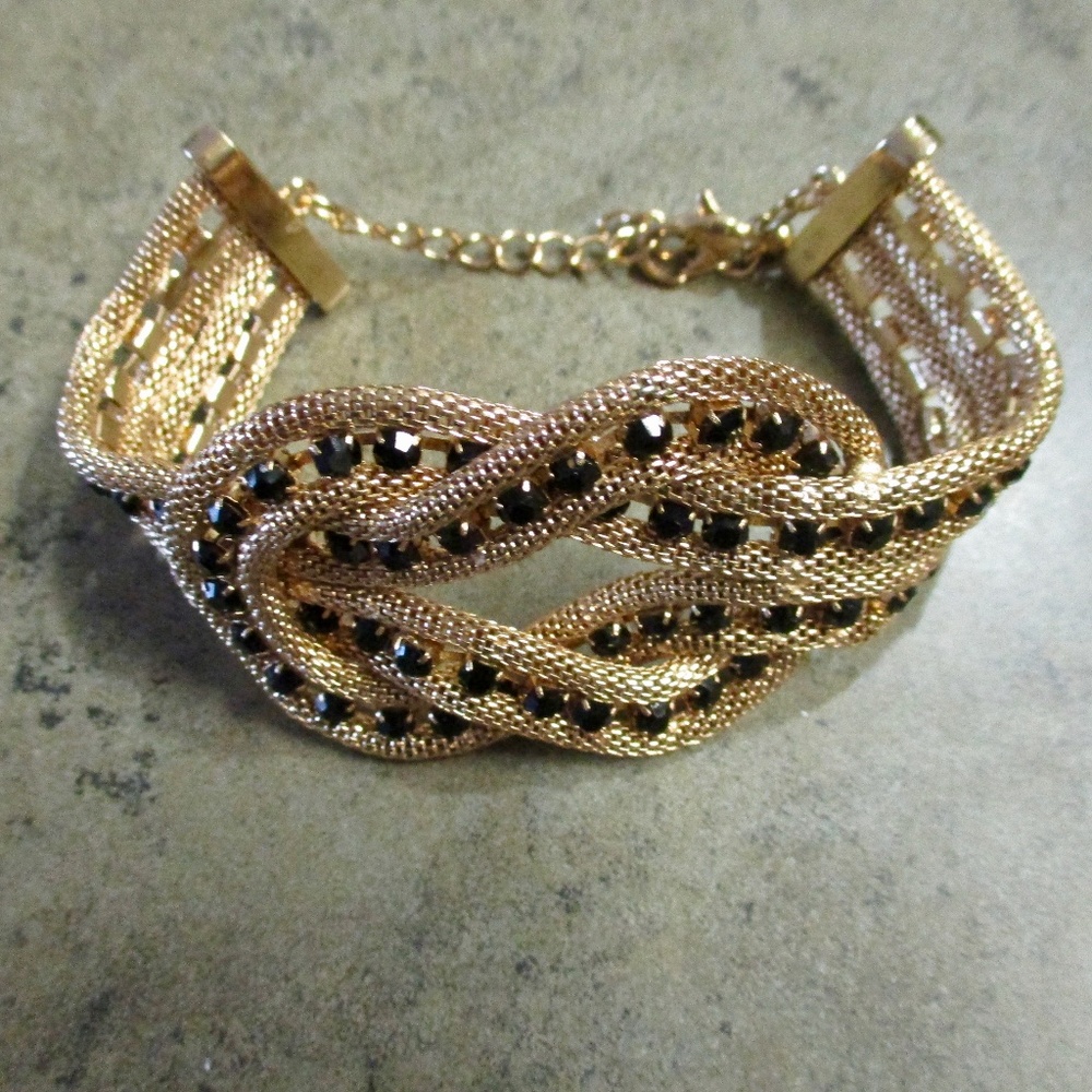 Gold Tone Infinity Style Bracelet w/Black Stones